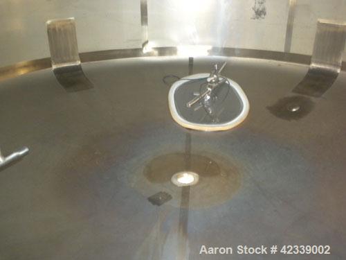 Used Cherry-Burrell Tank, 3000 Gallon, 304 Stainless Steel, Vertical. 84" Diameter x 116" straight side, dish top and bottom. Internal CIP spray ball. Side bottom agitator with a 3 blade prop, driven...