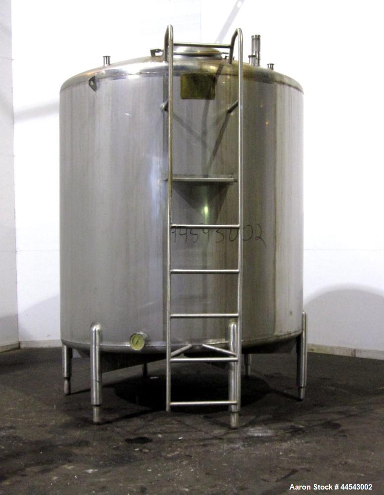 Used Cherry Burrell Tank, 2000 Gallon, 304 Stainless Steel, Vertical. 84” Diameter x 81” straight side, dished top, sloped bottom. (1) Spray ball, external side ladder. Openings: top (2) 2”, 3”, 3" v...