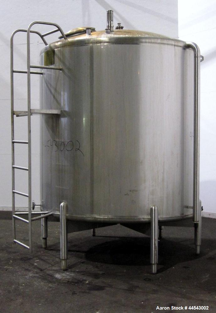 Used Cherry Burrell Tank, 2000 Gallon, 304 Stainless Steel, Vertical. 84” Diameter x 81” straight side, dished top, sloped bottom. (1) Spray ball, external side ladder. Openings: top (2) 2”, 3”, 3" v...