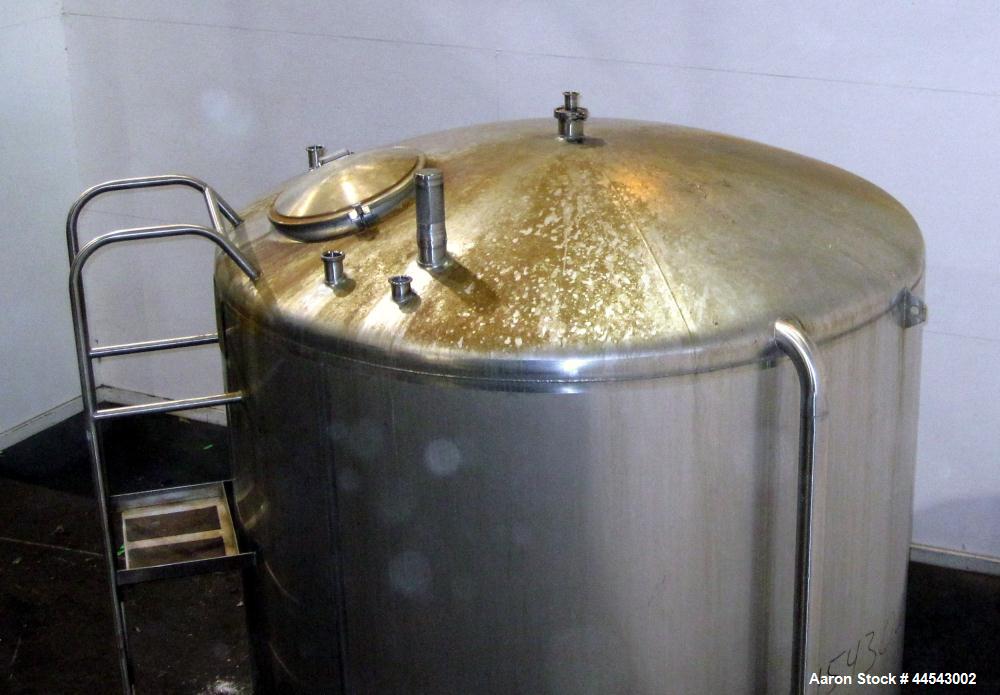 Used Cherry Burrell Tank, 2000 Gallon, 304 Stainless Steel, Vertical. 84” Diameter x 81” straight side, dished top, sloped bottom. (1) Spray ball, external side ladder. Openings: top (2) 2”, 3”, 3" v...