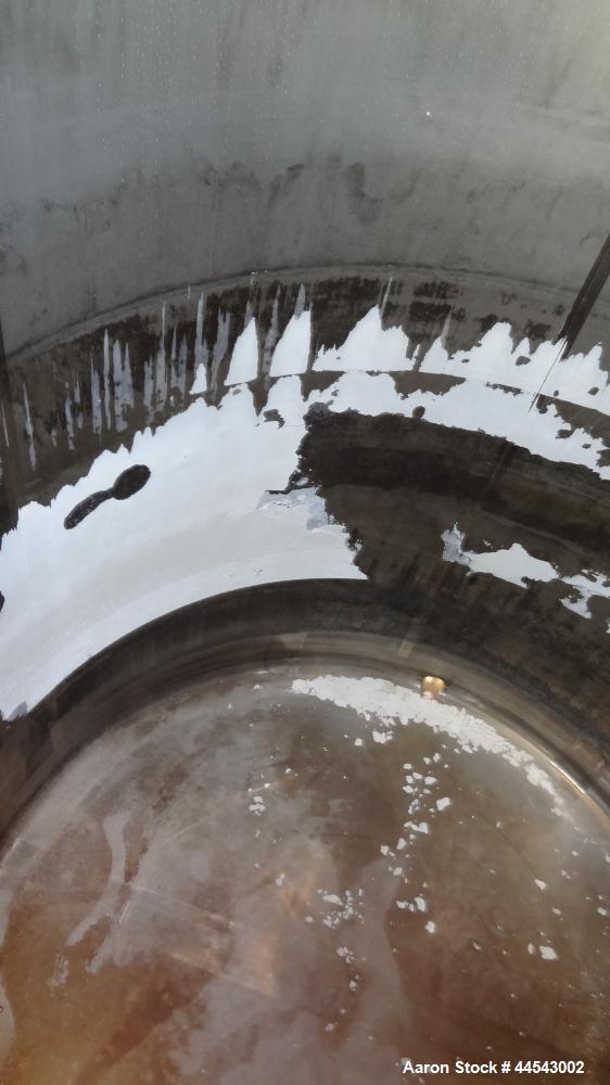 Used Cherry Burrell Tank, 2000 Gallon, 304 Stainless Steel, Vertical. 84” Diameter x 81” straight side, dished top, sloped bottom. (1) Spray ball, external side ladder. Openings: top (2) 2”, 3”, 3" v...