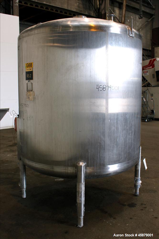 Used Cherry Burrell Type C Tank, Model CVS, 1,000 Gallon, 304 Stainless Steel, Vertical. Approximately 64" diameter x 60" straight side. Dished top and bottom. Design pressure 7 psi. Top openings: 17...