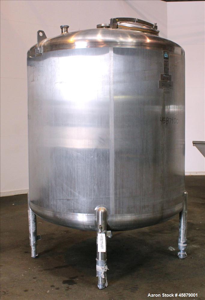 Used Cherry Burrell Type C Tank, Model CVS, 1,000 Gallon, 304 Stainless Steel, Vertical. Approximately 64" diameter x 60" straight side. Dished top and bottom. Design pressure 7 psi. Top openings: 17...