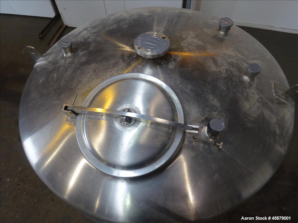 Used Cherry Burrell Type C Tank, Model CVS, 1,000 Gallon, 304 Stainless Steel, Vertical. Approximately 64" diameter x 60" straight side. Dished top and bottom. Design pressure 7 psi. Top openings: 17...