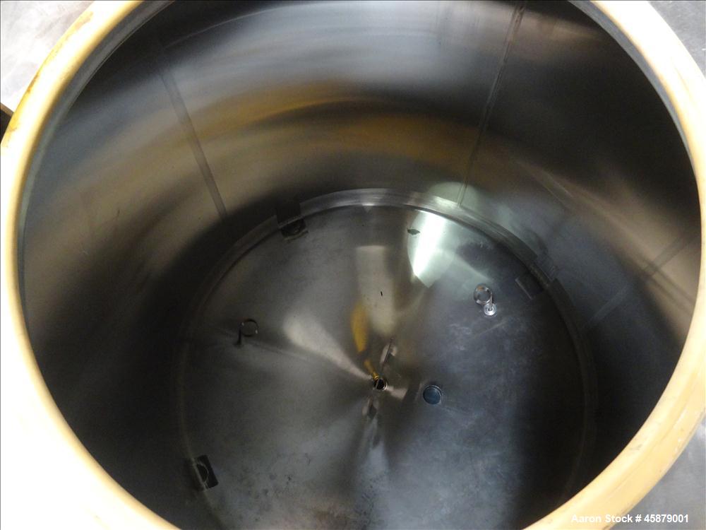Used Cherry Burrell Type C Tank, Model CVS, 1,000 Gallon, 304 Stainless Steel, Vertical. Approximately 64" diameter x 60" straight side. Dished top and bottom. Design pressure 7 psi. Top openings: 17...