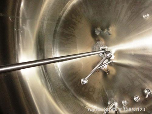 Used Cherry Burrell 2,000 Gallon Top Agitated Mixing Tank, Model CV.  304 Stainless steel mixing tank with (4) stainless steel legs.  Approximately 7' diameter x 6'6" straight wall x 13' overall heig...