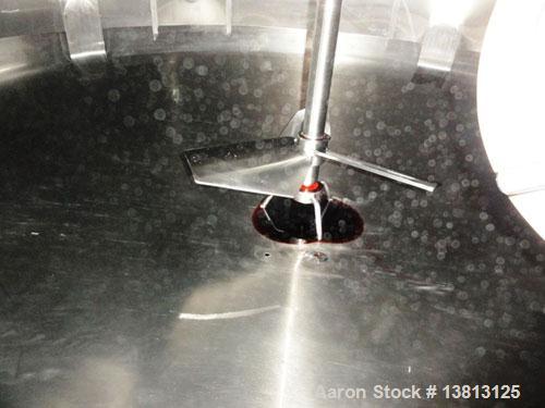 Used Cherry Burrell 2,000 Gallon Top Agitated Mixing Tank, Model CV.  304 Stainless steel mixing tank with (4) stainless steel legs.  Approximately 7' diameter x 6'6" straight wall x 13' overall heig...