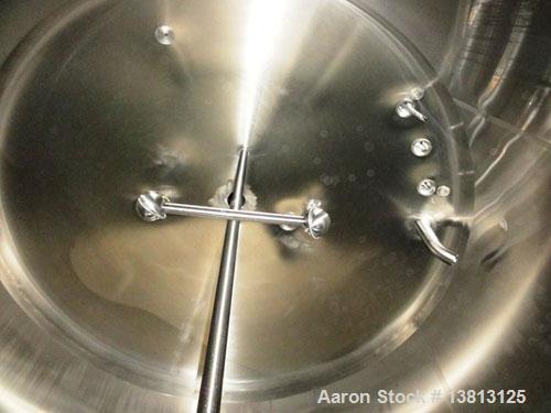 Used Cherry Burrell 2,000 Gallon Top Agitated Mixing Tank, Model CV.  304 Stainless steel mixing tank with (4) stainless steel legs.  Approximately 7' diameter x 6'6" straight wall x 13' overall heig...