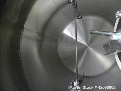 Used Cherry Burrell Storage Tank, 3000 gallon, model GHW, 304 stainless steel, horizontal. 84" diameter x 108" straight side, dished heads. Insulated with carbon steel sheathing. 1/4 Channel jacket o...
