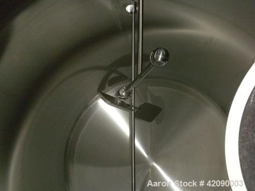Used Cherry Burrell Storage Tank, 3000 gallon, model GHW, 316 stainless steel, horizontal. 84'' diameter x 108'' straight side, dished heads. Insulated with carbon steel sheathing. 1/4 channel jacket...