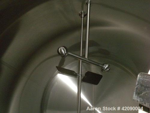 Used Cherry Burrell Storage Tank, 3000 gallon, 304 stainless steel, horizontal. 84'' diameter x 108'' straight side, dished heads. Insulated with carbon steel sheathing. 1/4 channel jacket on partial...
