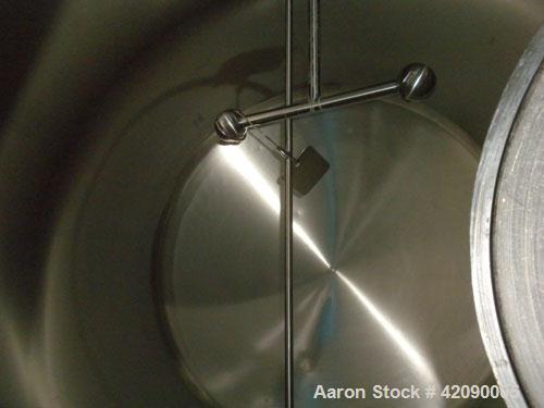 Used Cherry Burrell Storage Tank, 3000 gallon, 304 stainless steel, horizontal. 84'' diameter x 108'' straight side, dished heads. Insulated with carbon steel sheathing. 1/4 Channel jacket on partial...