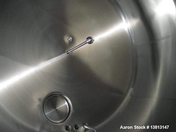 Used Cherry Burrell Stainless Steel Tank with  5 hp side agitator, 8' straight wall, 9' diameter, 15' overall length, domed top/bottom, (6) stainless steel legs, top and front manways, center bottom ...