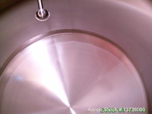 Unused-Used 3000 gallon stainless steel tank. Manufactured by Cherry Burrell. Approximately 87 inches in diameter X 117” long. Sanitary finish. Includes spray ball and side entering agitator. Lst use...
