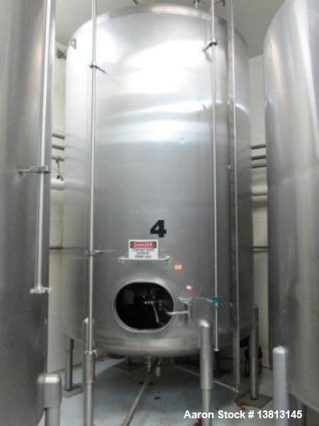 Used Cherry Burrell Stainless Steel Tank with type C side agitator, 9'6" straight wall, 84" diameter, 12' overall length, domed top/bottom, (6) stainless steel legs, 2.5" center bottom discharge, sin...