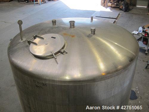 Used Cherry-Burrell Tank, 2000 Gallon, 316 Stainless Steel, Vertical. 84" Diameter x 84" straight side. Dished top, coned bottom. Openings top 1-1/2" tri-clamp, 3", (2) 2" NPT, 6", 18" man way with c...