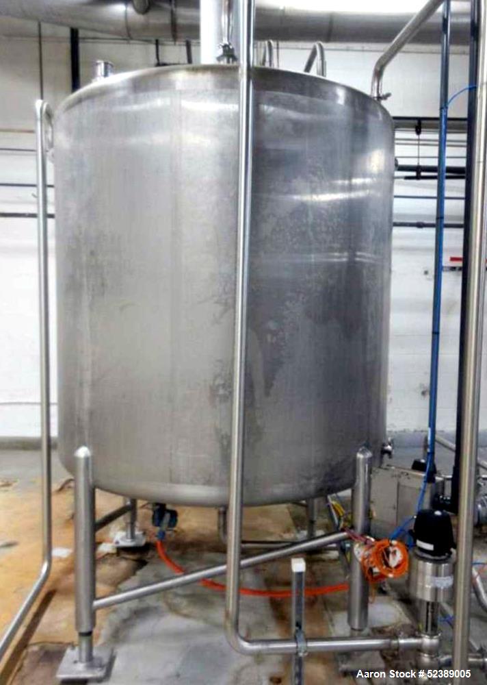 Used Cherry Burrell 1,000 Gallon Stainless Steel Tank, Vertical. Approximate 60" diameter x 76" straight side. Dished top and bottom. Openings top: (1) 2-1/2" sanitary thread reduced to 1-1/2" tri-cl...