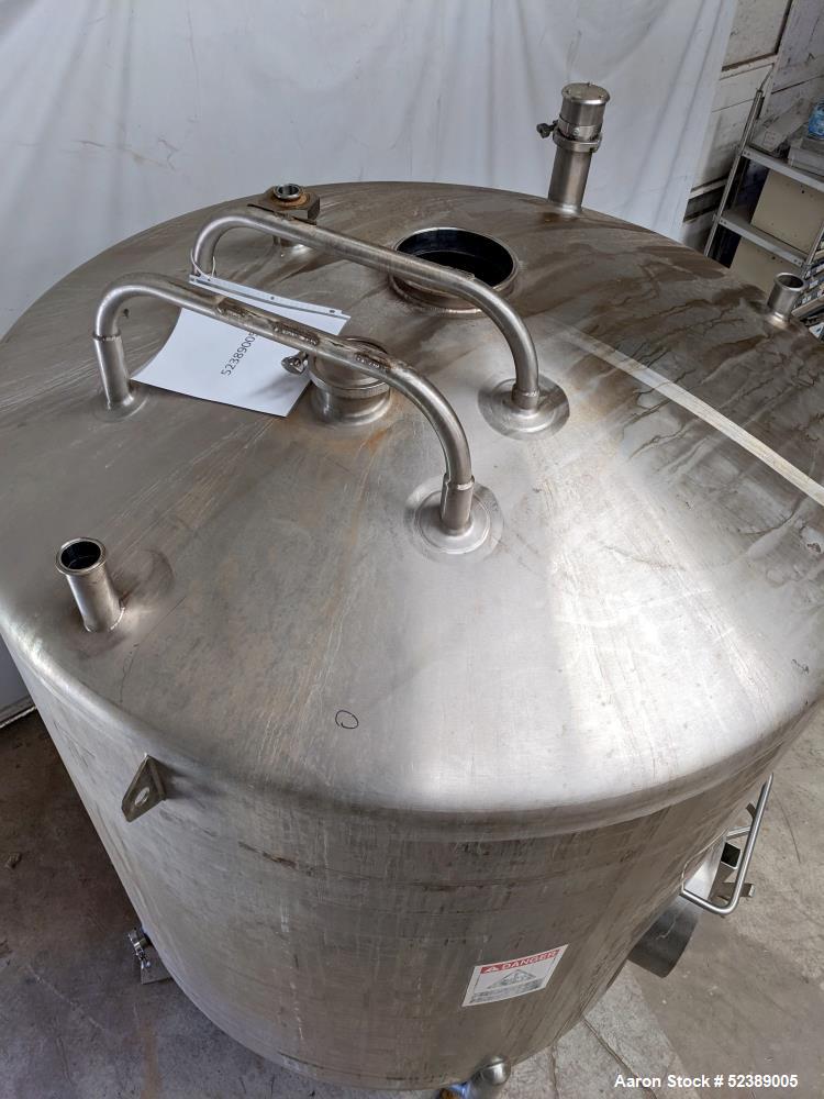 Used Cherry Burrell 1,000 Gallon Stainless Steel Tank, Vertical. Approximate 60" diameter x 76" straight side. Dished top and bottom. Openings top: (1) 2-1/2" sanitary thread reduced to 1-1/2" tri-cl...
