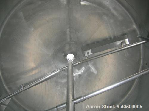 Used Creamery Package Tank, 1000 gallon, 304 stainless steel, vertical. 72" diameter x 53" straight side. Dished top, coned bottom. Fixed carbon steel agitator bridge, bottom supported anchor agitato...