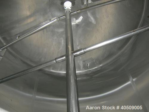Used Creamery Package Tank, 1000 gallon, 304 stainless steel, vertical. 72" diameter x 53" straight side. Dished top, coned bottom. Fixed carbon steel agitator bridge, bottom supported anchor agitato...