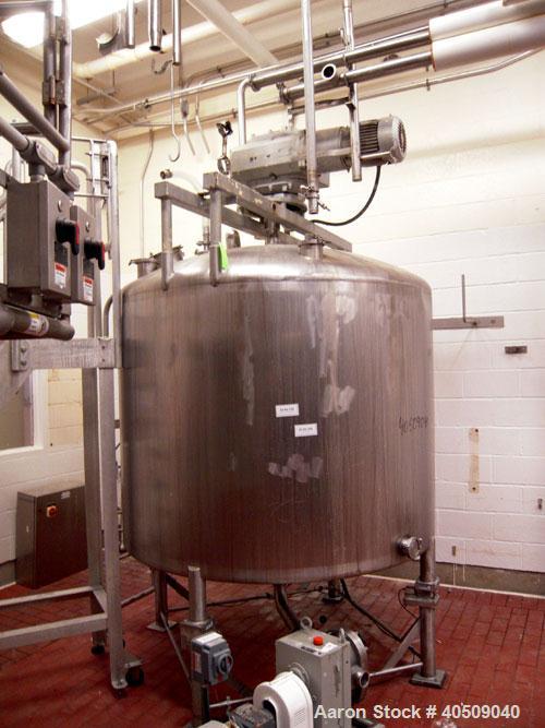 Used Creamery Package Tank, 1000 Gallon, stainless steel, vertical. 72" diameter x 54" straight side. Dished top, coned bottom. Fixed carbon steel agitator bridge, bottom supported anchor agitator wi...