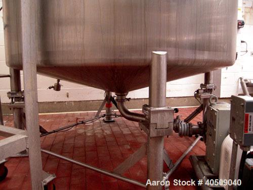 Used Creamery Package Tank, 1000 Gallon, stainless steel, vertical. 72" diameter x 54" straight side. Dished top, coned bottom. Fixed carbon steel agitator bridge, bottom supported anchor agitator wi...