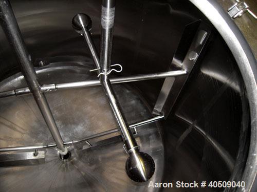 Used Creamery Package Tank, 1000 Gallon, stainless steel, vertical. 72" diameter x 54" straight side. Dished top, coned bottom. Fixed carbon steel agitator bridge, bottom supported anchor agitator wi...