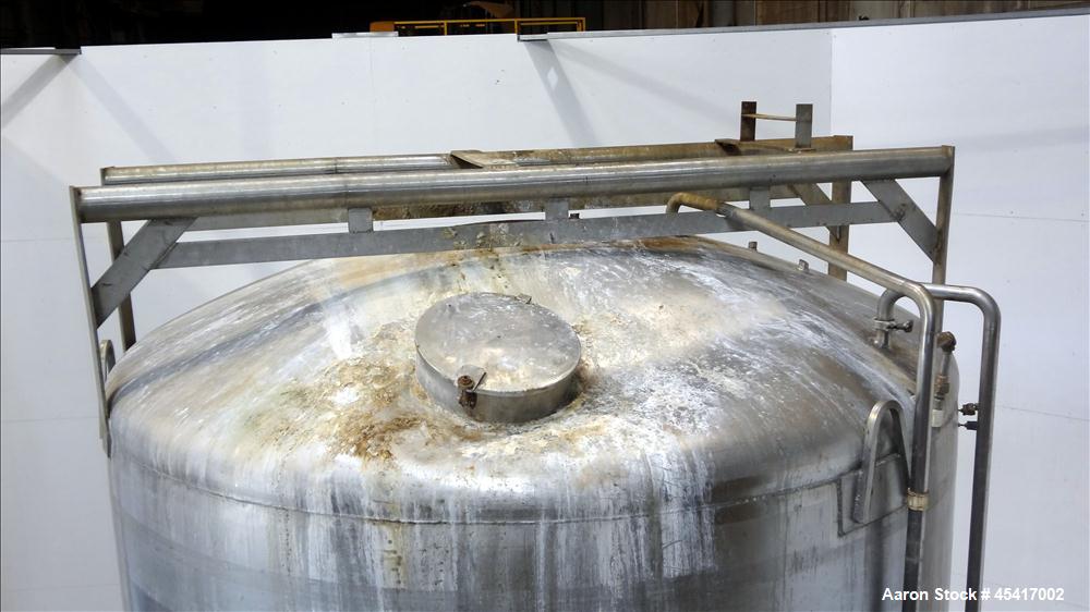 Used Crepaco Tank, 3500 Gallons, 304 Stainless Steel, Vertical. Approximate 96" Diameter x 118" Straight Side. Dish top (dented), coned bottom. Fixed stainless steel agitator bridge, (1) baffle, (1) ...