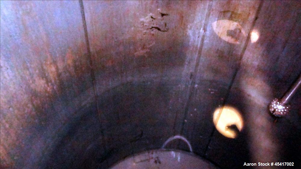 Used Crepaco Tank, 3500 Gallons, 304 Stainless Steel, Vertical. Approximate 96" Diameter x 118" Straight Side. Dish top (dented), coned bottom. Fixed stainless steel agitator bridge, (1) baffle, (1) ...