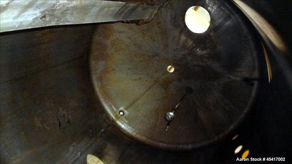 Used Crepaco Tank, 3500 Gallons, 304 Stainless Steel, Vertical. Approximate 96" Diameter x 118" Straight Side. Dish top (dented), coned bottom. Fixed stainless steel agitator bridge, (1) baffle, (1) ...