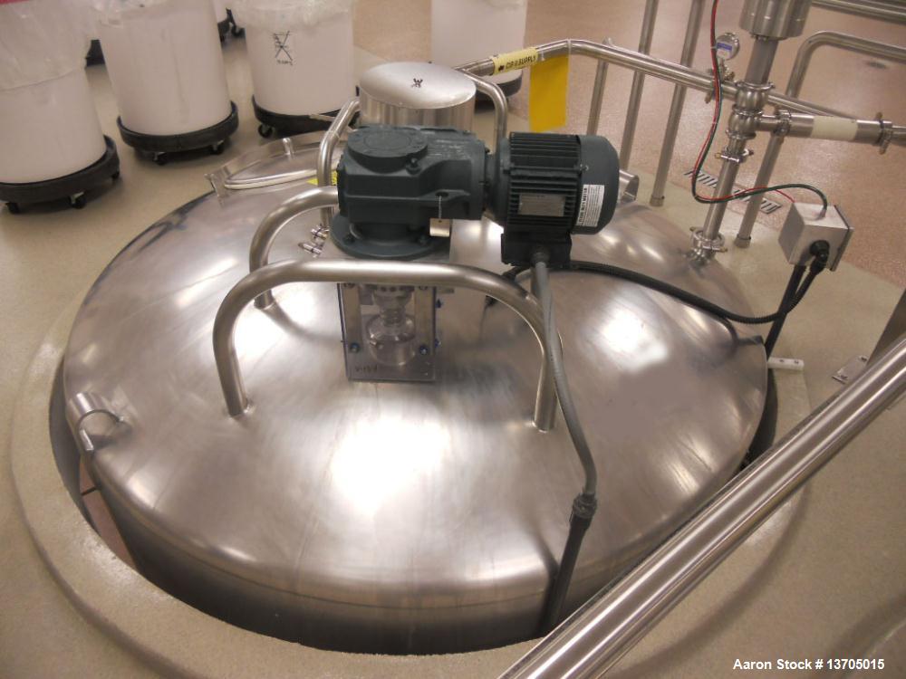 Used 3000 Gallon DCI Sanitary Stainless Steel Vertical Mix Tank, type 316L sanitary stainless steel construction.  7' Diameter x 10'6" straight side; sanitary stainless steel construction; slant bott...