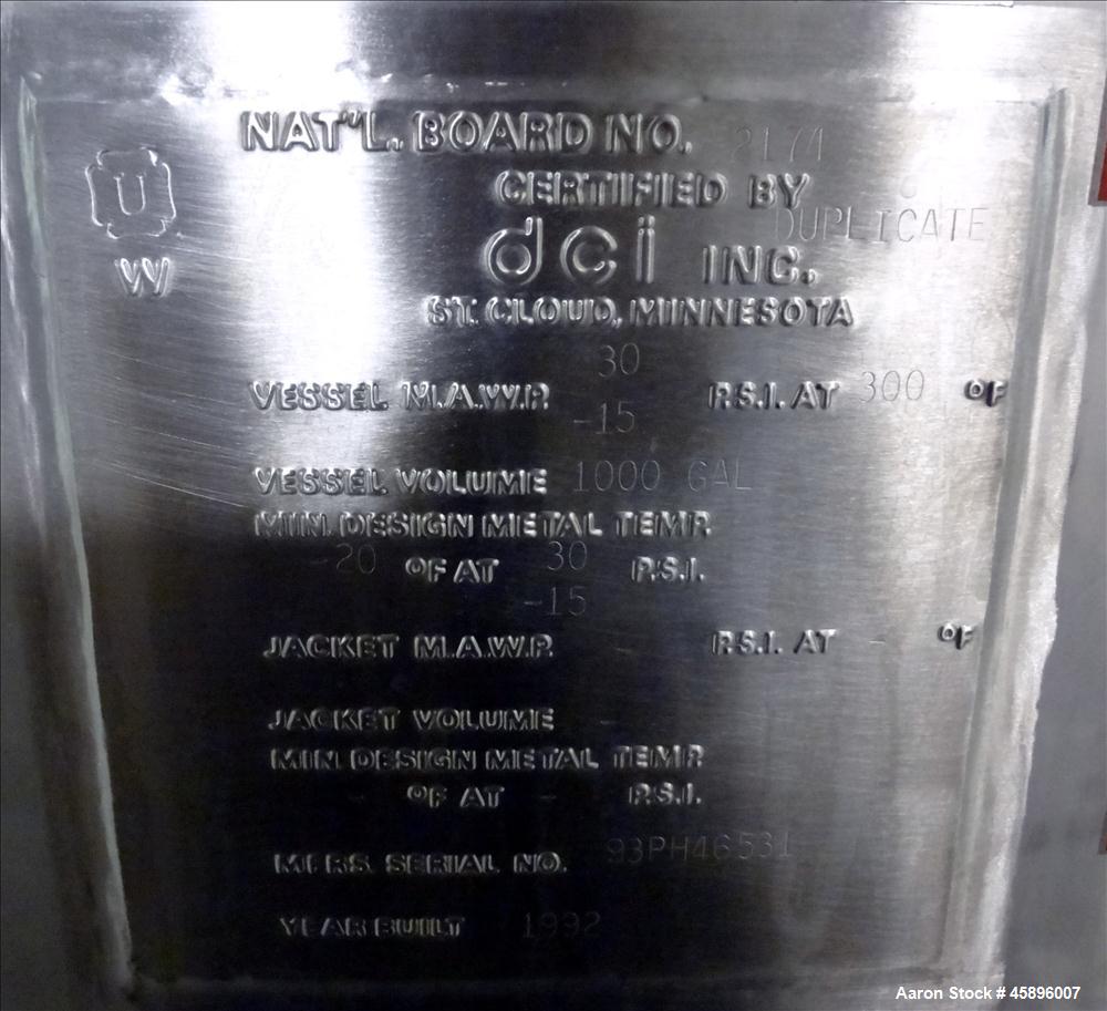 Used DCI Pressure Tank, 1000 Gallon, 316L Stainless Steel, Vertical. 76" Diameter x 52" straight side, dished top and bottom. 180 Grit finished internal rated 30/-15 psi at -20 to 300 degrees F. Insu...