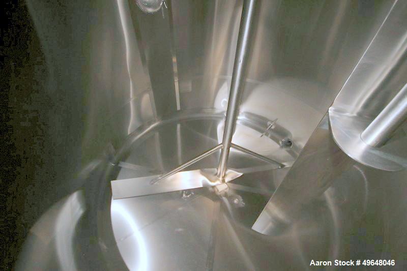 Used DCI 2,000 Gallon Stainless Steel Single Wall Mix Tank, Vertical. Dome Top/Cone Bottom. Top mounted agitation with bottom sweep blade and motor. Top entering baffle. Dual CIP Spray Ball. Mounted ...