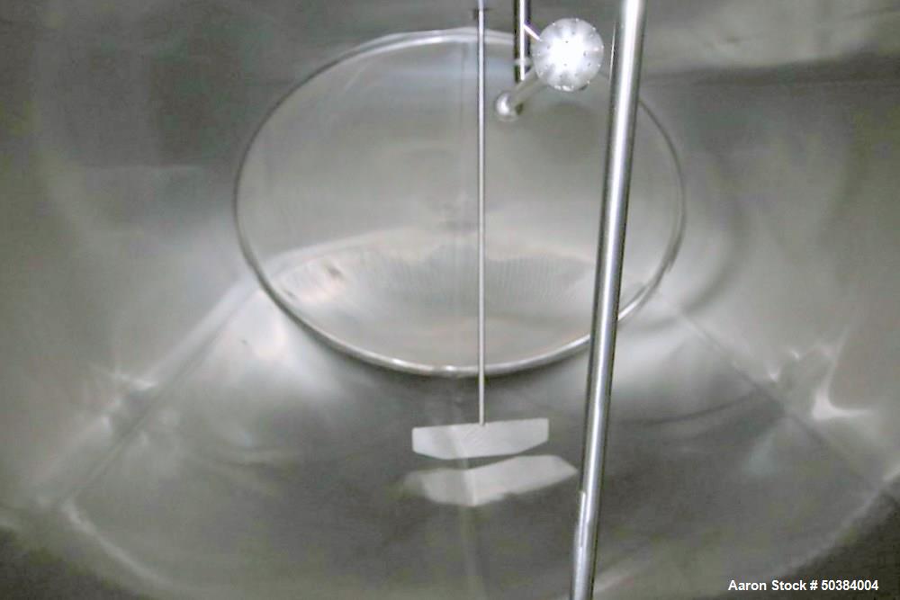 Used Dari-Kool 3,000 Gal. Stainless Steel Horizontal Jacketed Tank, with Vertical Agitation, CIP Spray Ball, and Air Valve, with Stainless Steel Exterior.