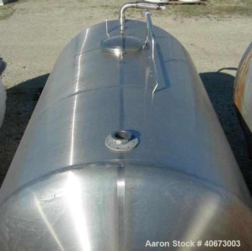 Used Delaval tank, 4,803 gallon (4000 Imperial), 304 stainless steel, horizontal.  Approximately 95" diameter x 144" straight side, dished heads.  2 Internal CIP spray balls.  Top Openings:  18" manw...