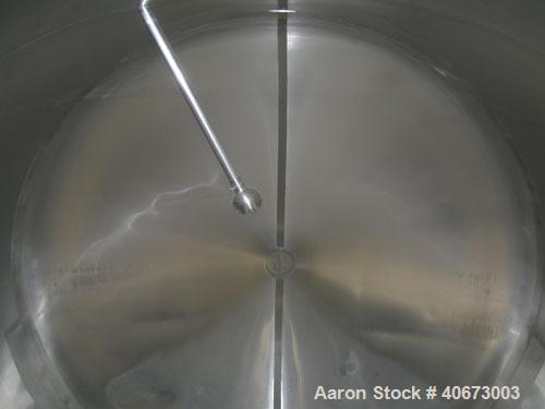 Used Delaval tank, 4,803 gallon (4000 Imperial), 304 stainless steel, horizontal.  Approximately 95" diameter x 144" straight side, dished heads.  2 Internal CIP spray balls.  Top Openings:  18" manw...