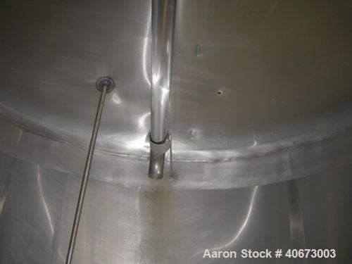 Used Delaval tank, 4,803 gallon (4000 Imperial), 304 stainless steel, horizontal.  Approximately 95" diameter x 144" straight side, dished heads.  2 Internal CIP spray balls.  Top Openings:  18" manw...