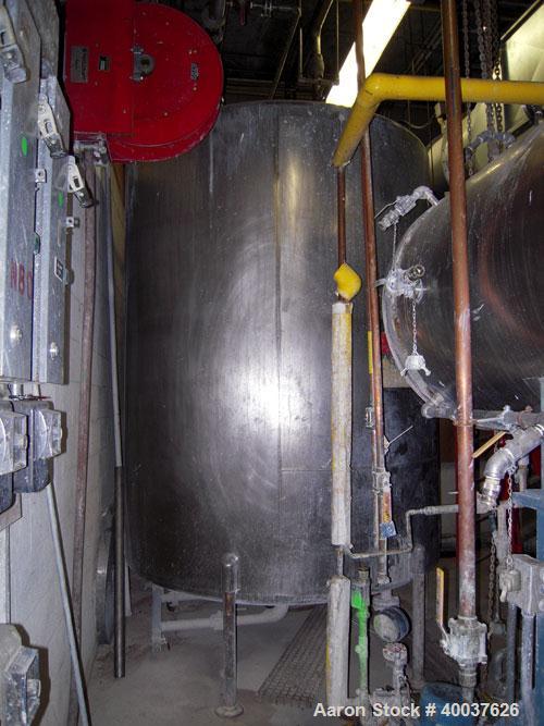 Used Ertel Tank, 2000 gallon, stainless steel, vertical. Approximately 80" diameter x 96" straight side. Slight dished top and bottom. Openings top (3)2", 17" manway, bottom 2", 4" center. Mounted on...