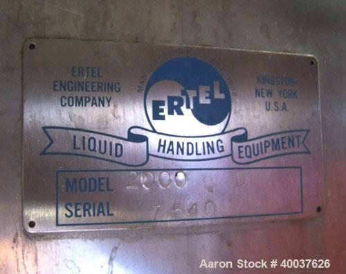 Used Ertel Tank, 2000 gallon, stainless steel, vertical. Approximately 80" diameter x 96" straight side. Slight dished top and bottom. Openings top (3)2", 17" manway, bottom 2", 4" center. Mounted on...