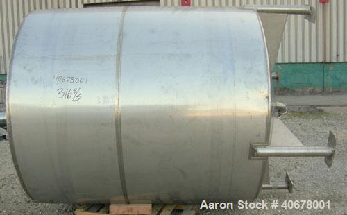 Used Feldmeier Tank, 1900 gallon, 316 stainless steel, vertical. 80" diameter x 84" straight side, coned top and bottom. Openings: top 4", 2" tri-clamp, 20" manway with cover; 3" tri-clamp tangential...