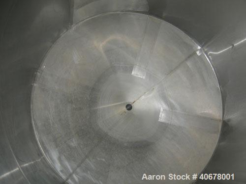Used Feldmeier Tank, 1900 gallon, 316 stainless steel, vertical. 80" diameter x 84" straight side, coned top and bottom. Openings: top 4", 2" tri-clamp, 20" manway with cover; 3" tri-clamp tangential...