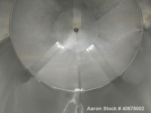 Used Feldmeier Tank, 1900 gallon, 316 stainless steel, vertical. 80" diameter x 84" straight side, coned top and bottom. Openings: top 4", 2" tri-clamp, 20" manway with cover; 3" tri-clamp tangential...