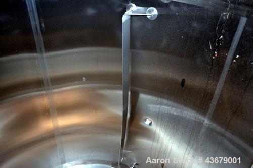 Used Feldmeier Tank, 1,500 Gallon, 316 Stainless Steel, Vertical. 72" Diameter x 78-1/2" straight side, dished top and bottom. (4) Side wall baffles. Openings top 2" tri-clamp, (3) 3" tri-clamp, 4" t...