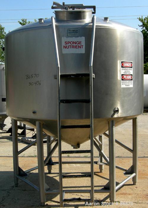 Used Feldmeier Mix Tank, 1000 Gallon, 304 Stainless Steel, Vertical. 82" Diameter x 48" straight side. Dished top, 44" coned bottom. Insulated. Fixed stainless steel agitator bridge with an approxima...