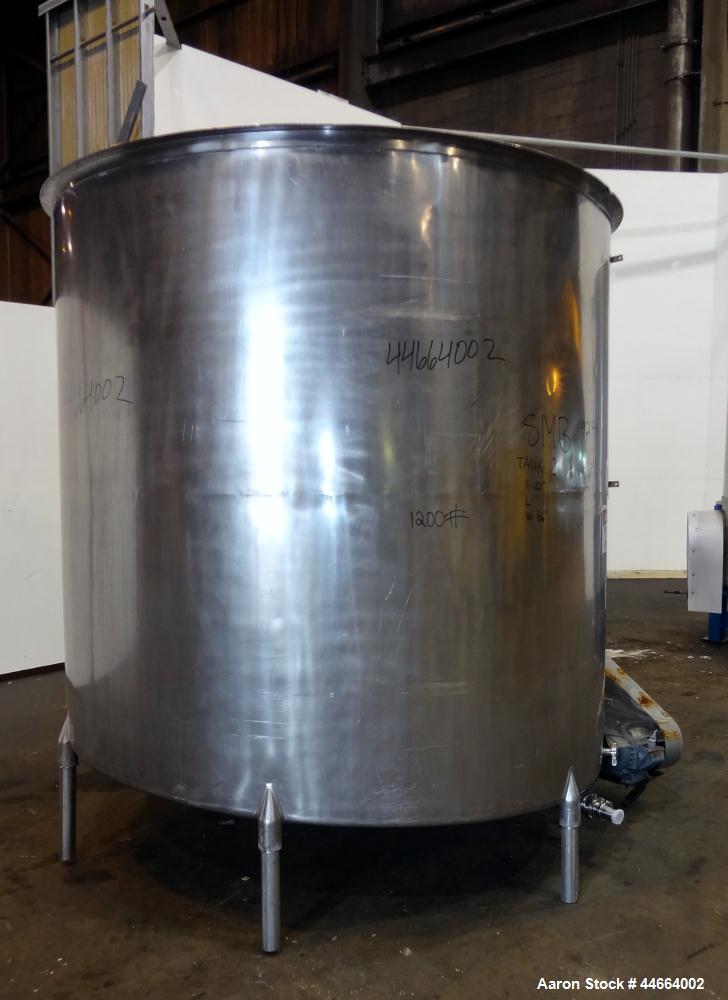 Used Filpaco Tank, 2000 Gallons, 304 Stainless Steel, Vertical. Approximate 86” Diameter X 81” straight side, open top with (2) covers, sloped bottom. Side bottom entering agitator with a (3) blade p...