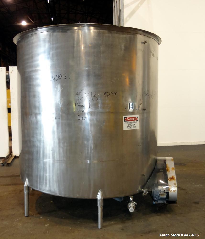Used Filpaco Tank, 2000 Gallons, 304 Stainless Steel, Vertical. Approximate 86” Diameter X 81” straight side, open top with (2) covers, sloped bottom. Side bottom entering agitator with a (3) blade p...