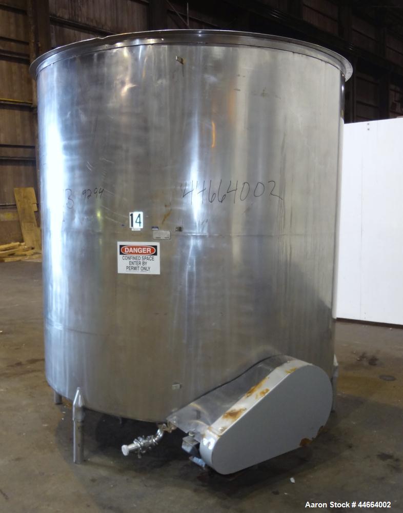 Used Filpaco Tank, 2000 Gallons, 304 Stainless Steel, Vertical. Approximate 86” Diameter X 81” straight side, open top with (2) covers, sloped bottom. Side bottom entering agitator with a (3) blade p...