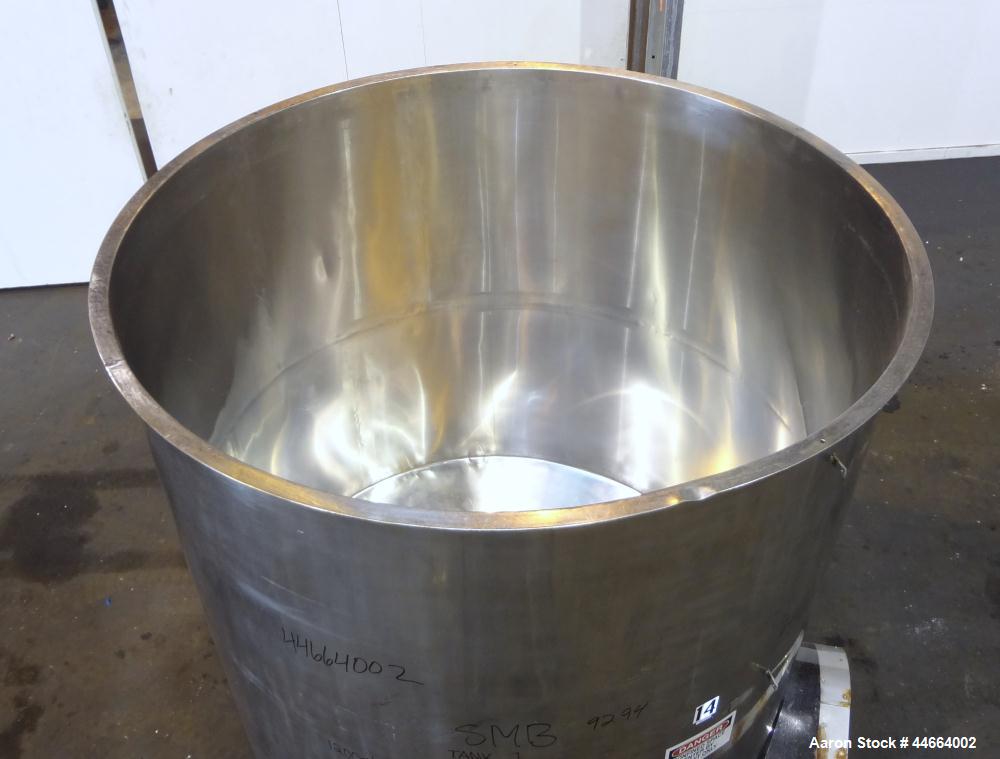 Used Filpaco Tank, 2000 Gallons, 304 Stainless Steel, Vertical. Approximate 86” Diameter X 81” straight side, open top with (2) covers, sloped bottom. Side bottom entering agitator with a (3) blade p...