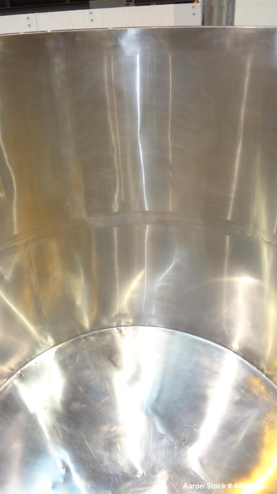 Used Filpaco Tank, 2000 Gallons, 304 Stainless Steel, Vertical. Approximate 86” Diameter X 81” straight side, open top with (2) covers, sloped bottom. Side bottom entering agitator with a (3) blade p...