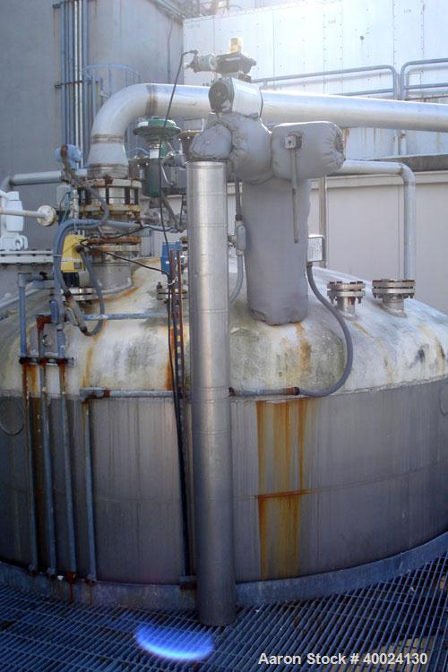 Used: Four Corp tank, approximately 6000 gallon, 316L stainless steel, vertical. Approximately 10' diameter x 11'6" straight side, dished top and bottom. Internal rated 10 psi at 150 deg.f.. Mounted ...